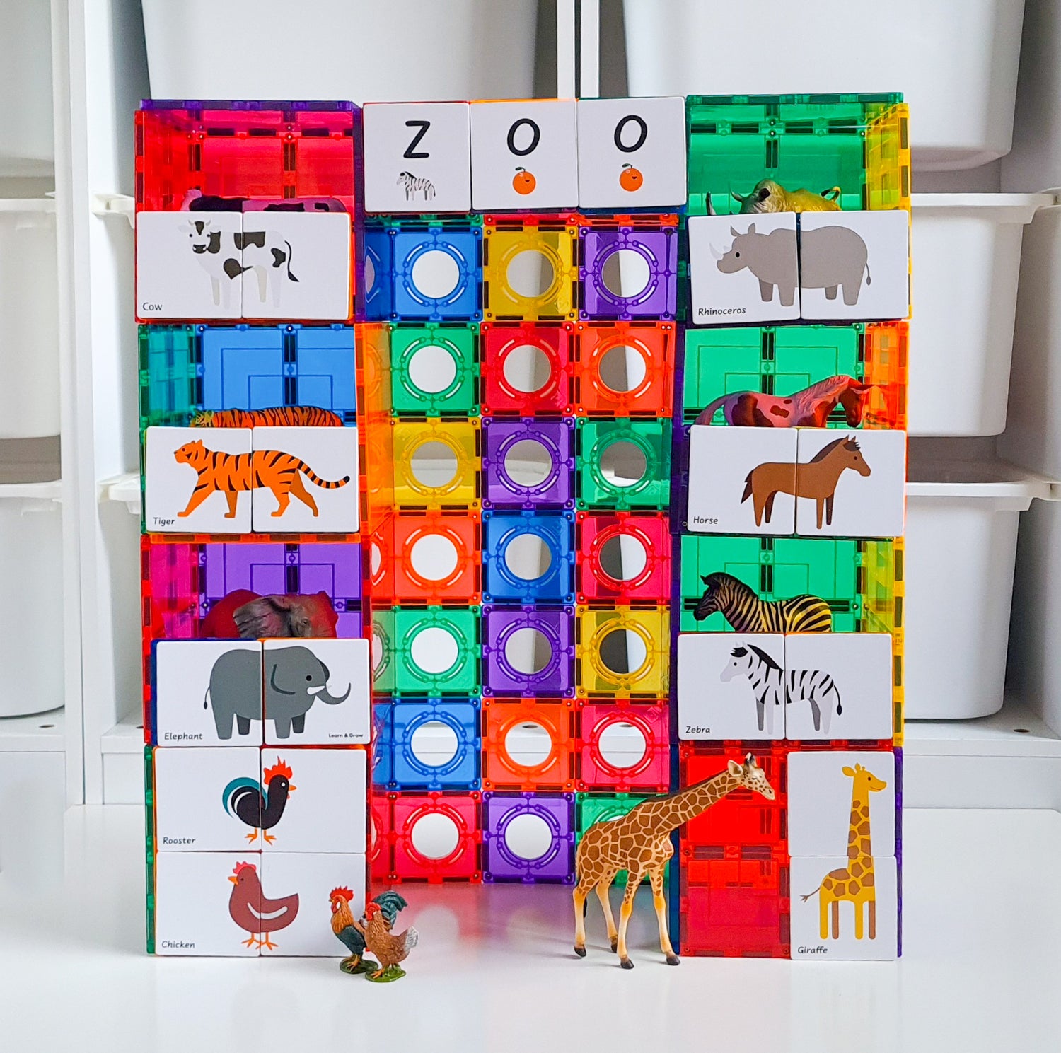 Duo Animal puzzle pack set up as a zoo on a tall square magnetic tile structure