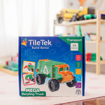 TileTek Mega Recycling Truck toy set packaging on a table with a blurred background of toys.