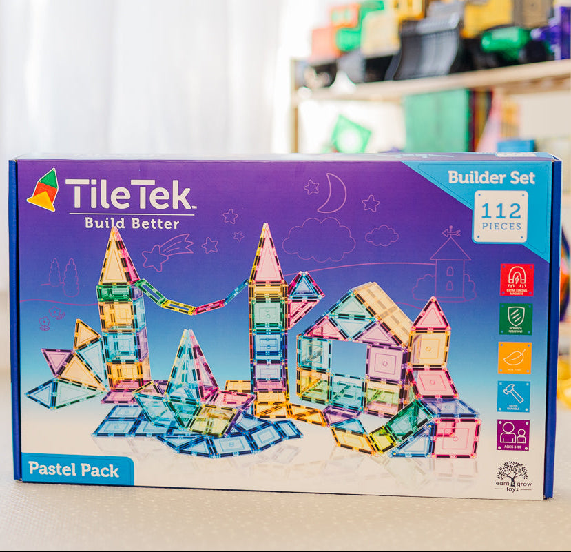 TileTek building block set packaging with colourful illustrations of structures on a light background.