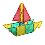 Colourful magnetic tiles made into a boat on a white background